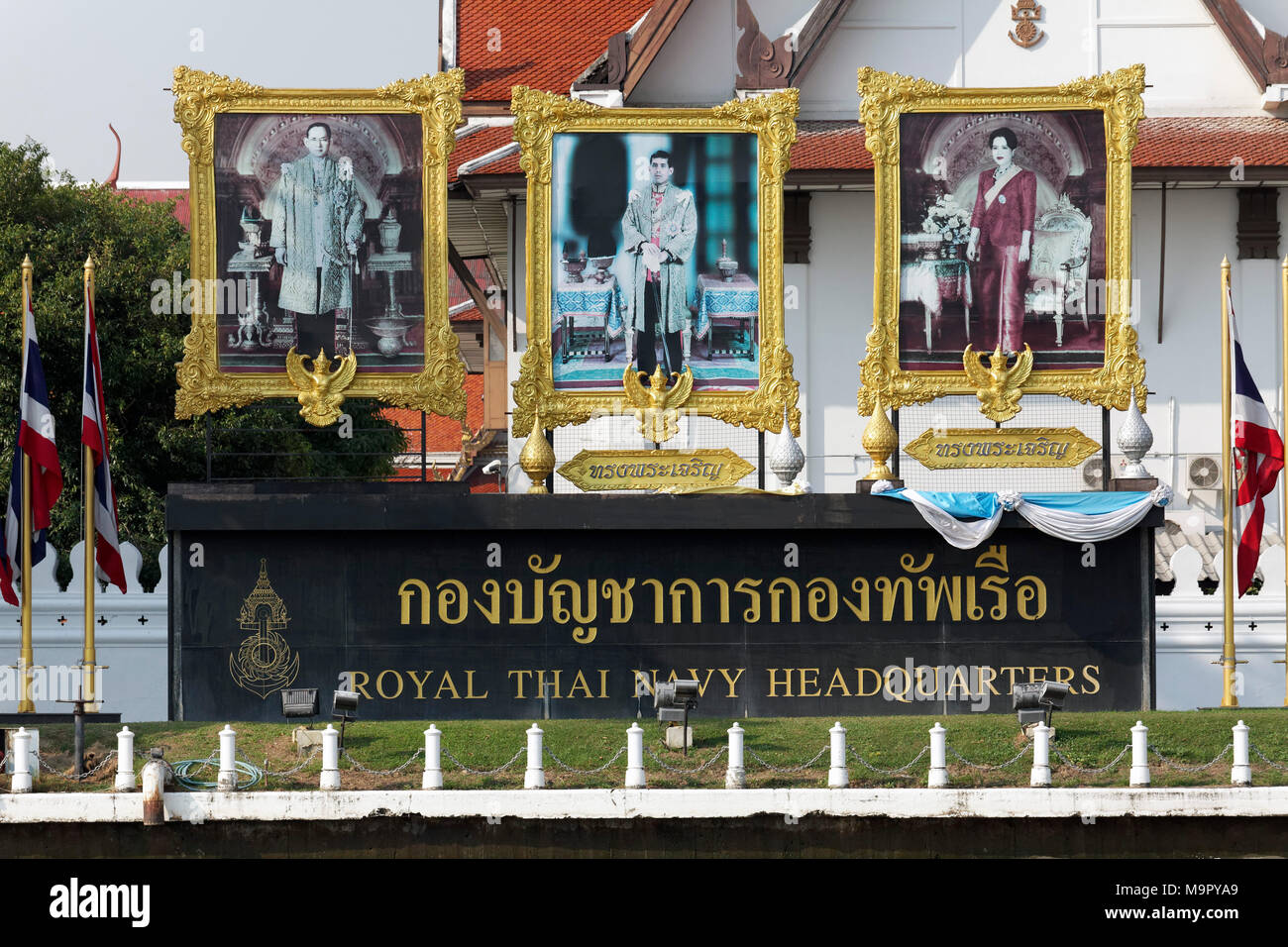 Large posters with Thai royal family, former king Bhumibol Adulyadej, queen Sirikit, crown prince Mama Vajiralongkorn, in front Stock Photo