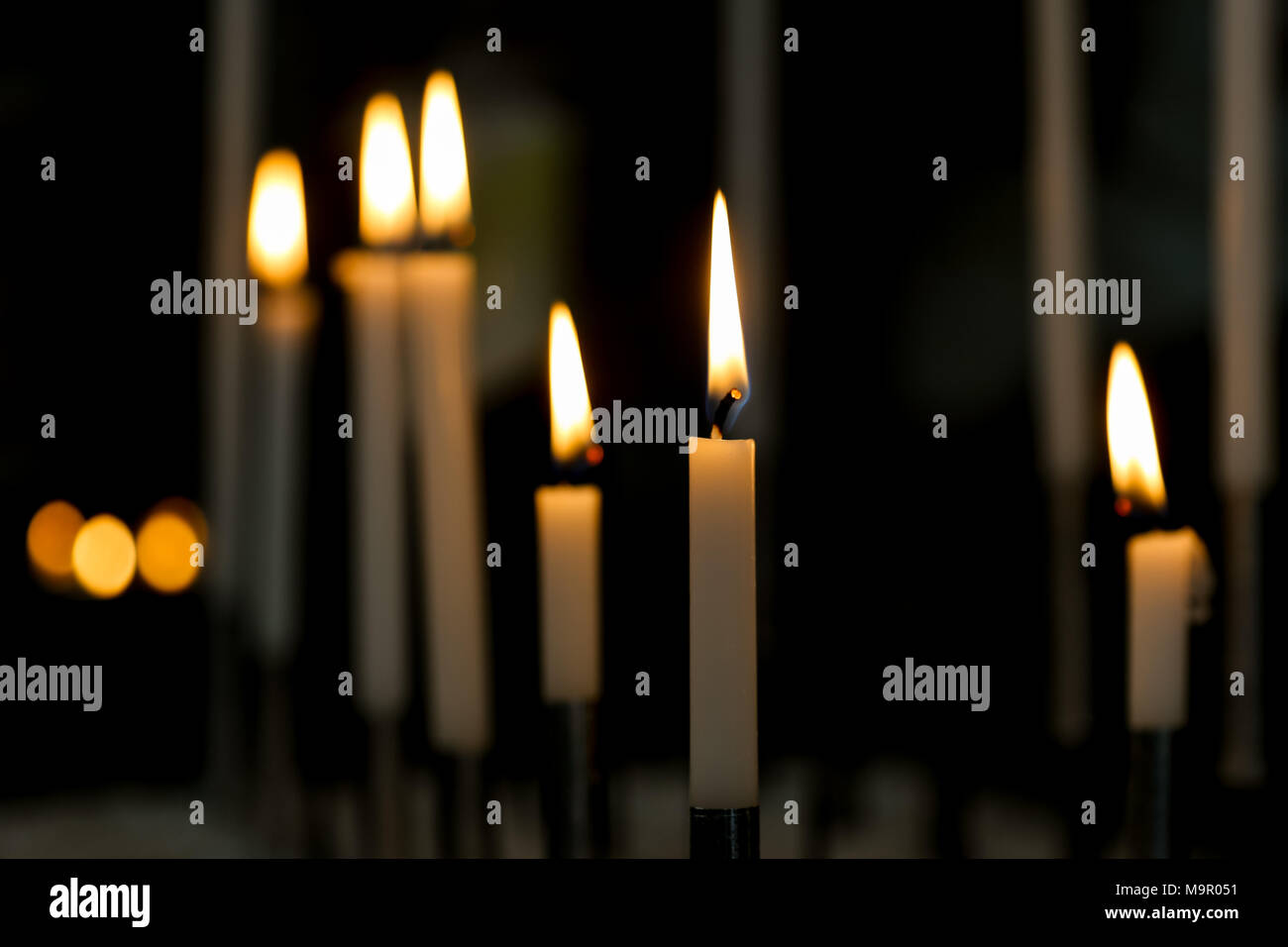 Candle lights in a Church in The Netherlands. Candle with golden flame