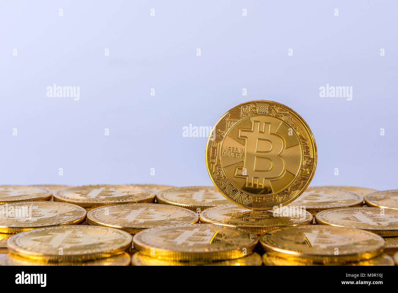 Golden bitcoin in pile of coins on background of BNP Paribas bank logo  Stock Photo - Alamy