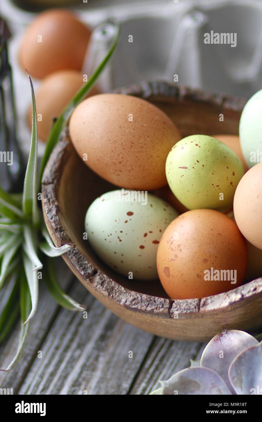 Colorful Easter eggs on wooden table Stock Photo