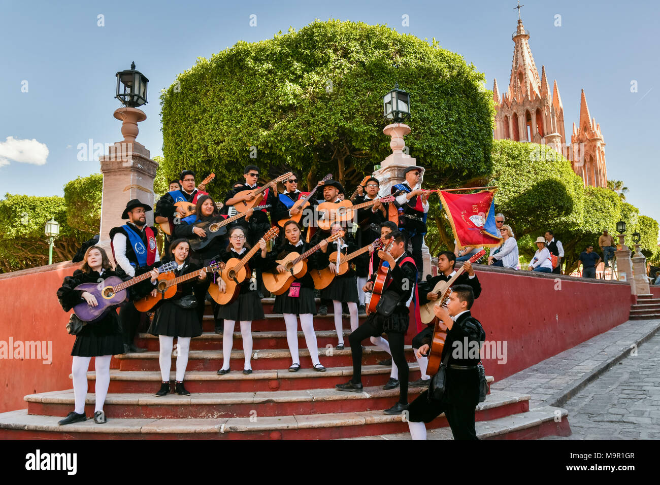 The University of Guanajuato Estudiantinas Callejoneadas music group serenade pedestrians in the Plaza Allende March 23, 2018 in San Miguel de Allende, Mexico. The group plays traditional Spanish music while strolling the streets in the style ofrenaissance balladeers. Stock Photo