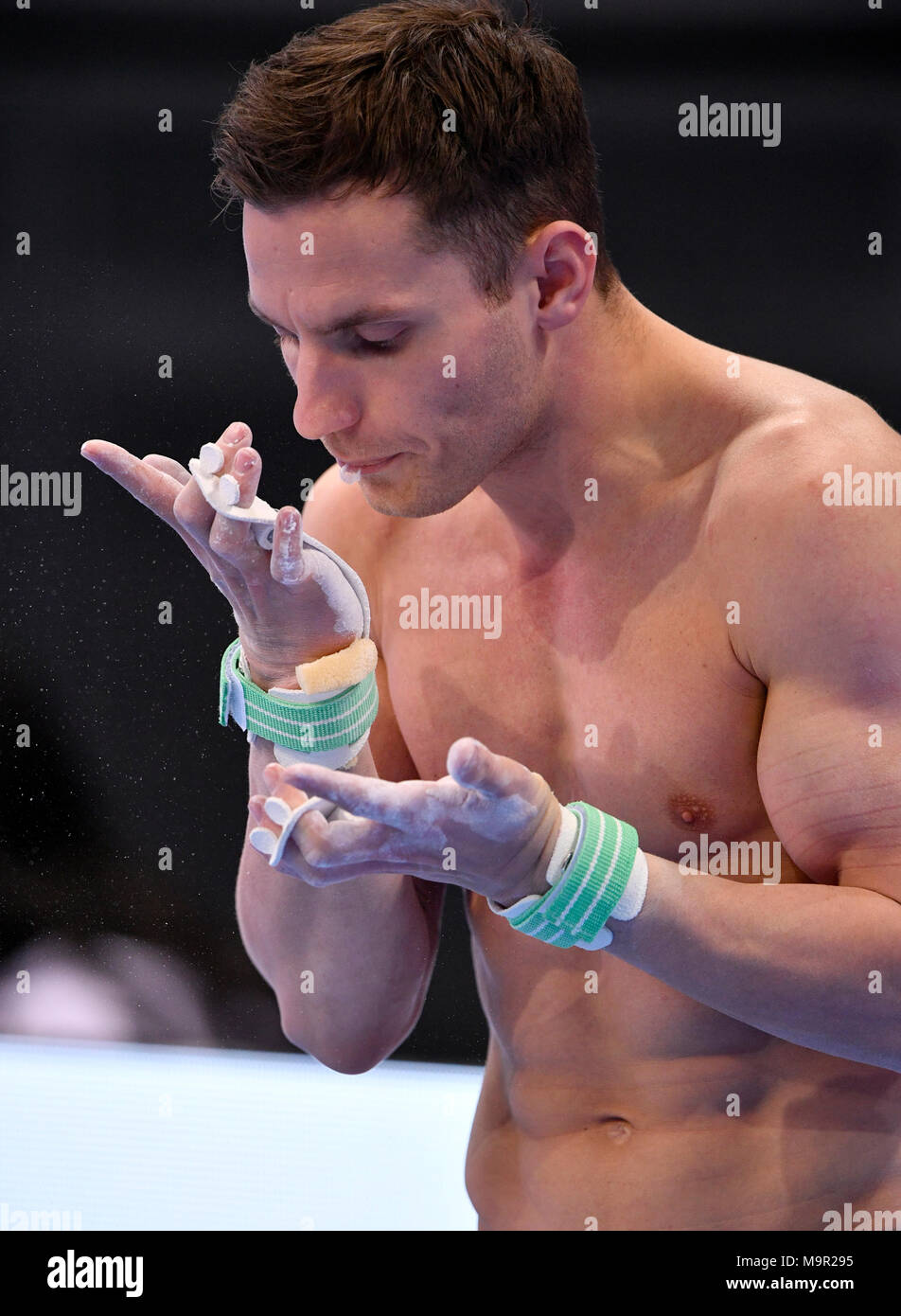 Apparatus gymnastics, Andreas Bretschneider, GER, spits into hands, Porsche Arena, Stuttgart, Baden-Württemberg, Germany Stock Photo