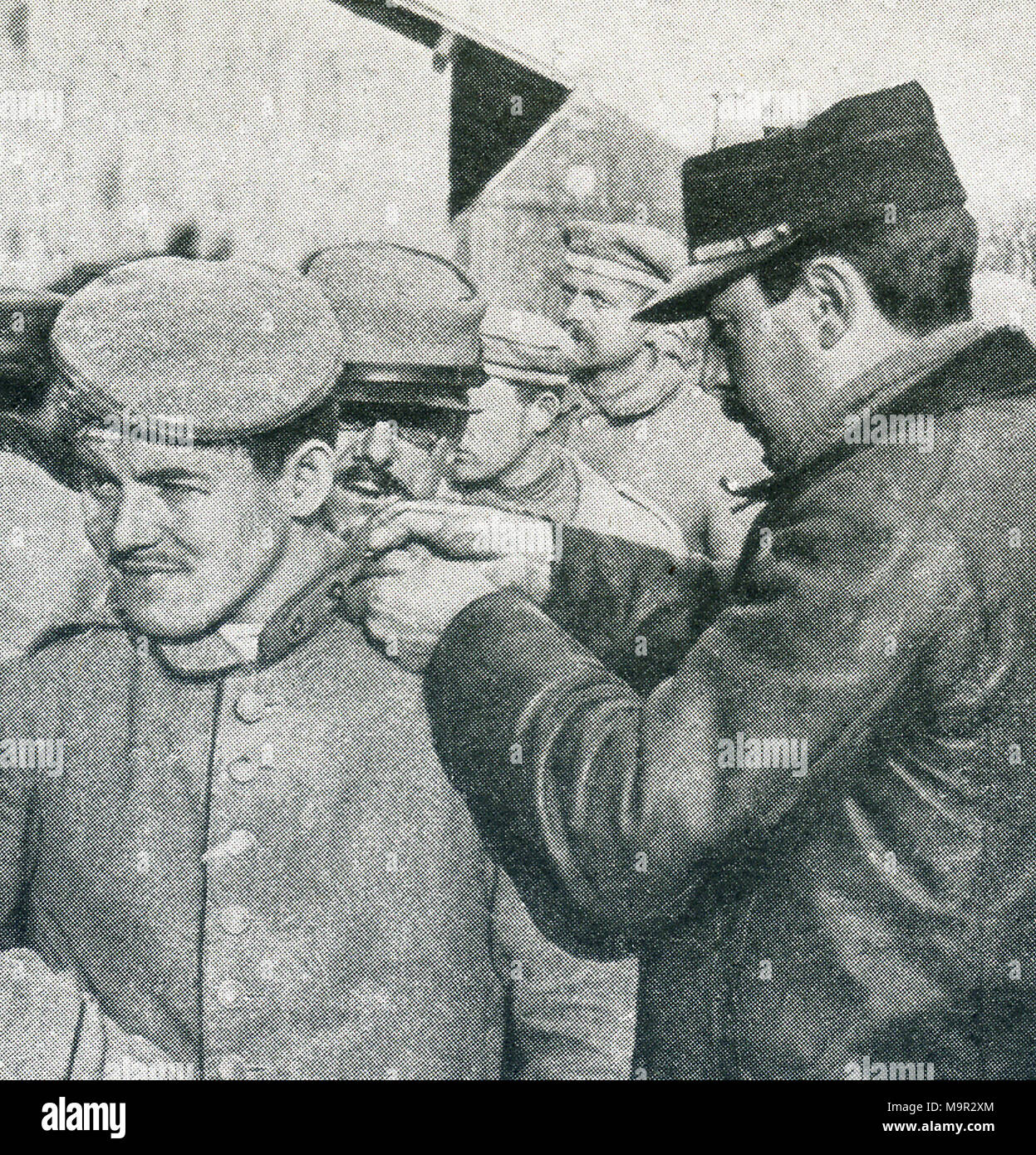 This photo dates to World War I and shows German prisoners. The caption says: No more fighting for them. German prisoners being inspected by French officers. Stock Photo
