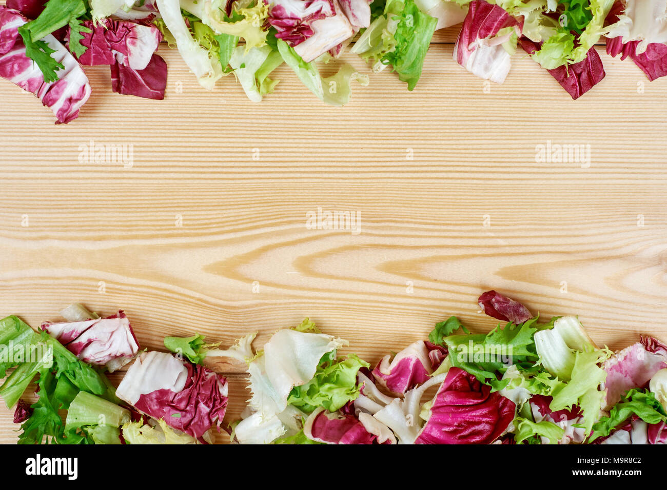 Download Frame Of Fresh Green Salad On Wooden Background Healthy Natural Food Mockup For Recipe Or Menu Stock Photo Alamy