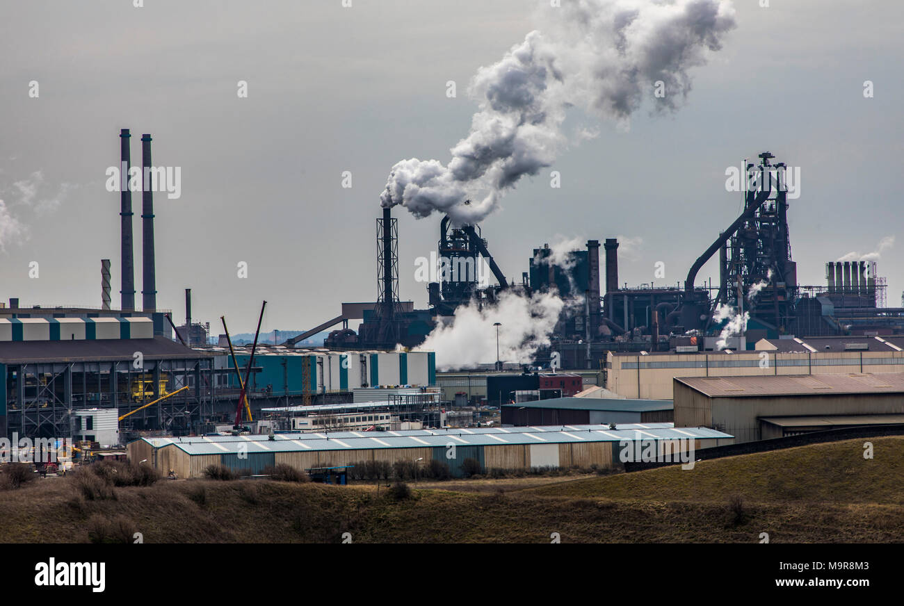 Factory Tata Steel with smoking chimneys on a sunny day, IJmuiden, The  Netherlands Stock Photo