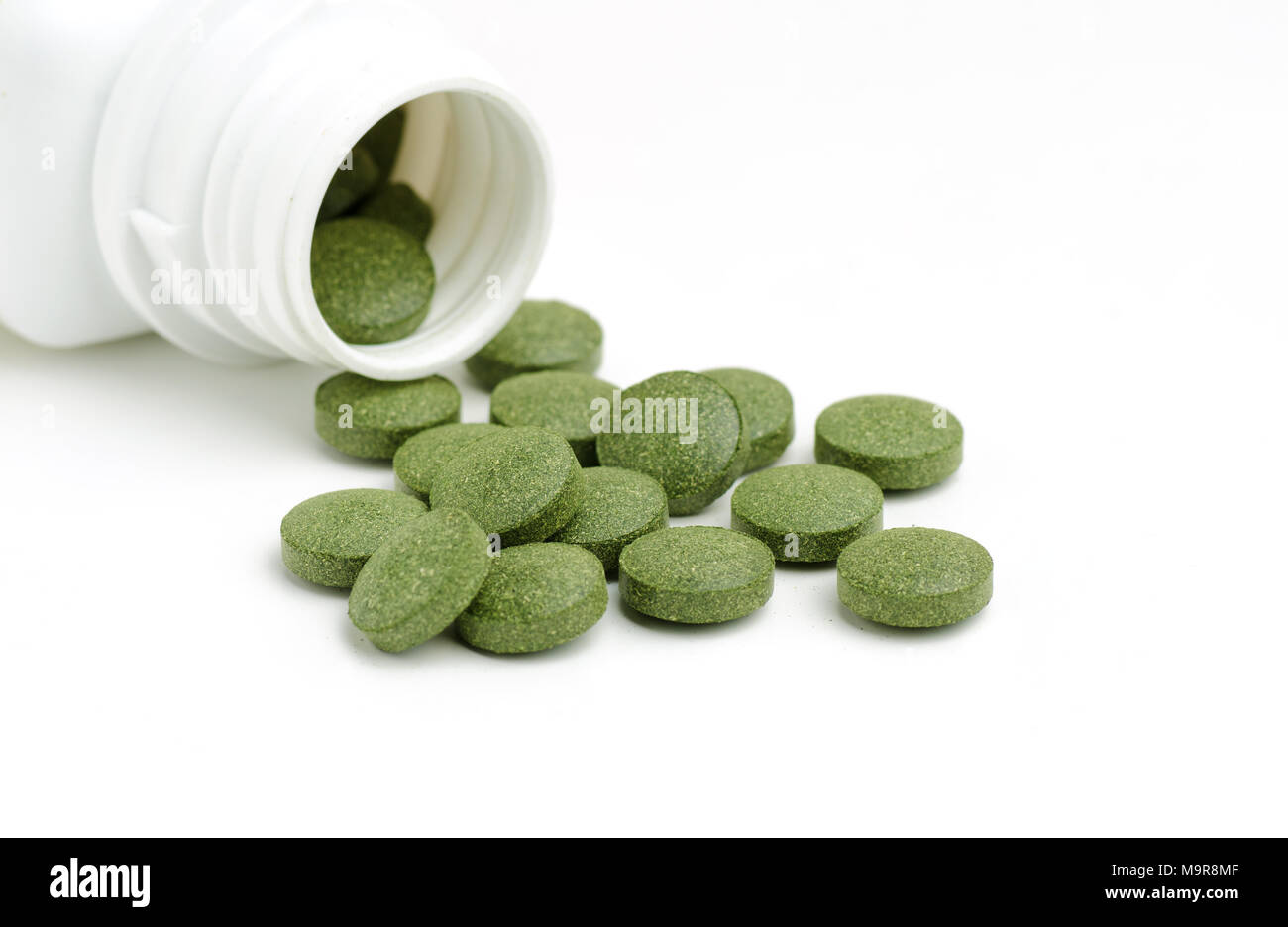 Green chlorella and spirulina pills. Nutritional supplement, healthy