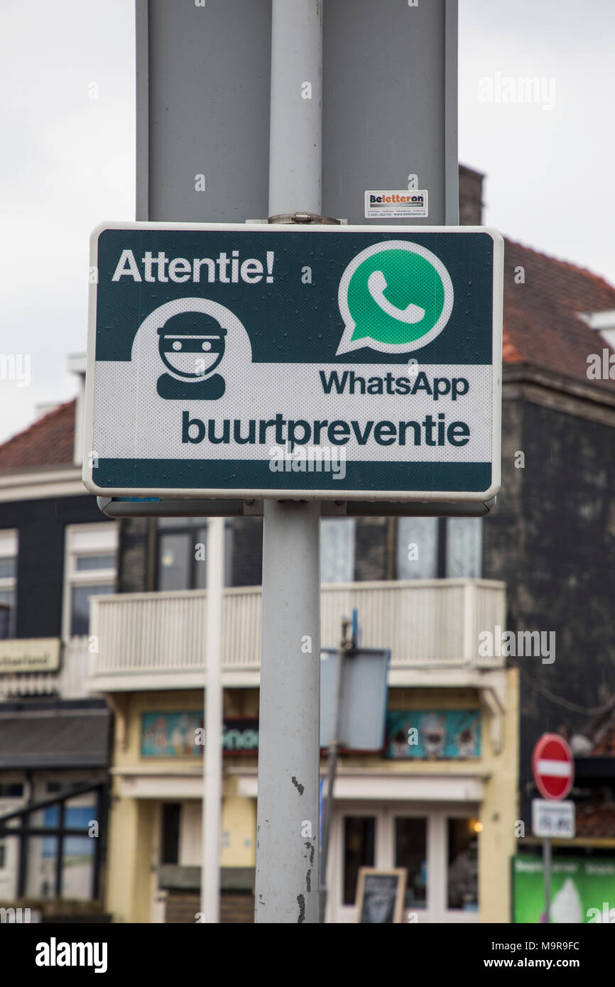 Neighborhood watch, warning that in this community, the neighbors are in contact via WhatsApp and are attentively watching the area, burglary preventi Stock Photo