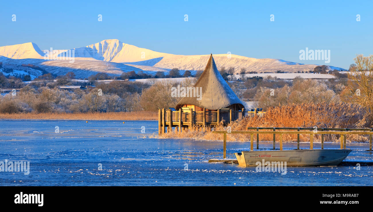 Llangorse Lake Brecon Beacons Powys Wales in winter with Pen y Fan & Corn Du mountains Stock Photo