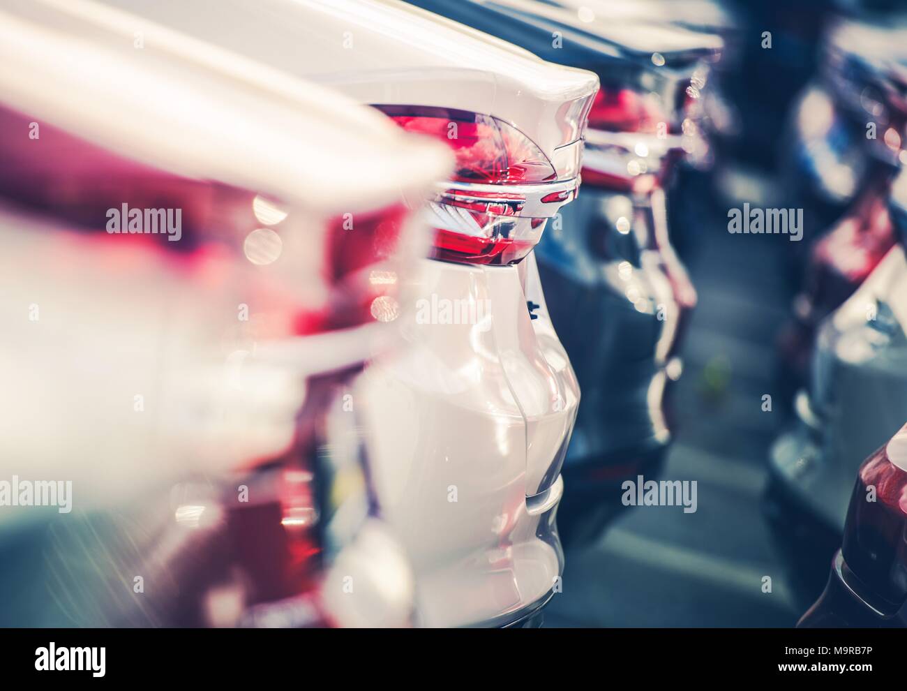 New Cars in Dealer Stock. Brand New Vehicles For Sale. Closeup Photo with Shallow Depth of Field. Transportation and Automotive Industry. Stock Photo