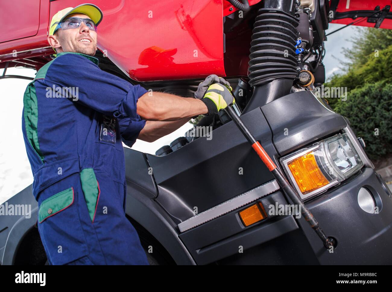 Semi Truck Maintenance By Professional Truck Mechanic Caucasian