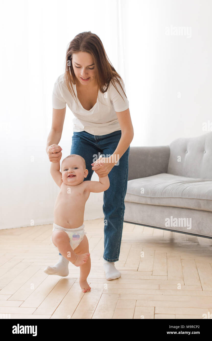Mother learning child to walk Stock Photo