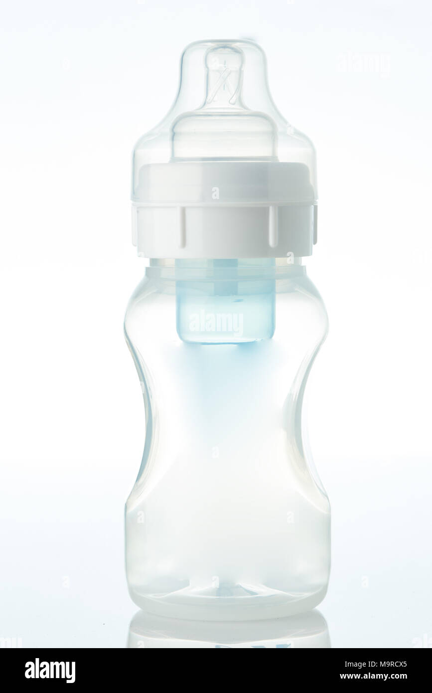 Clear bottle with nipple isolated on white background Stock Photo