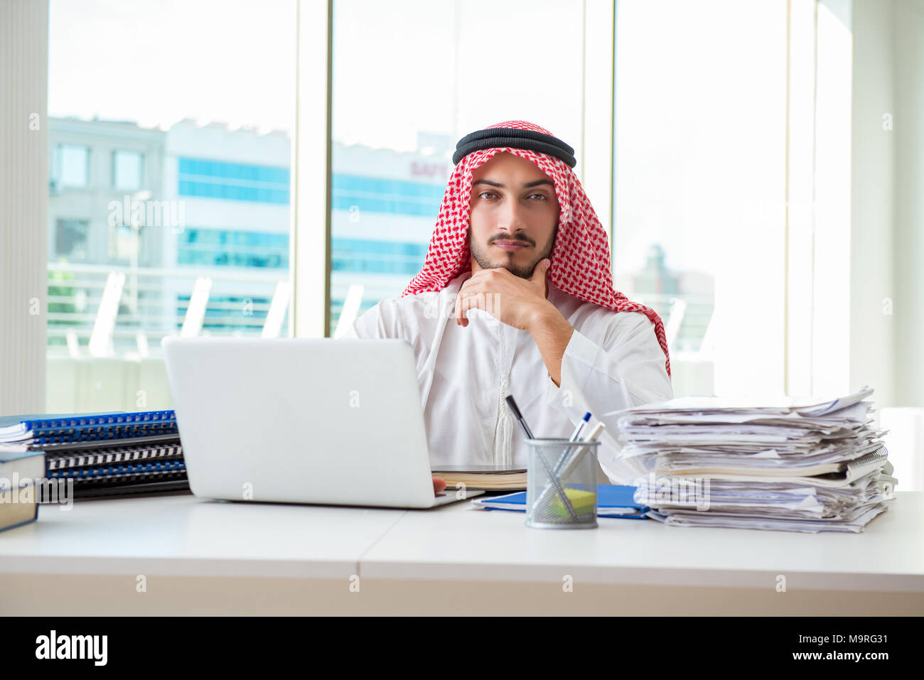Arab businessman working in the office Stock Photo - Alamy