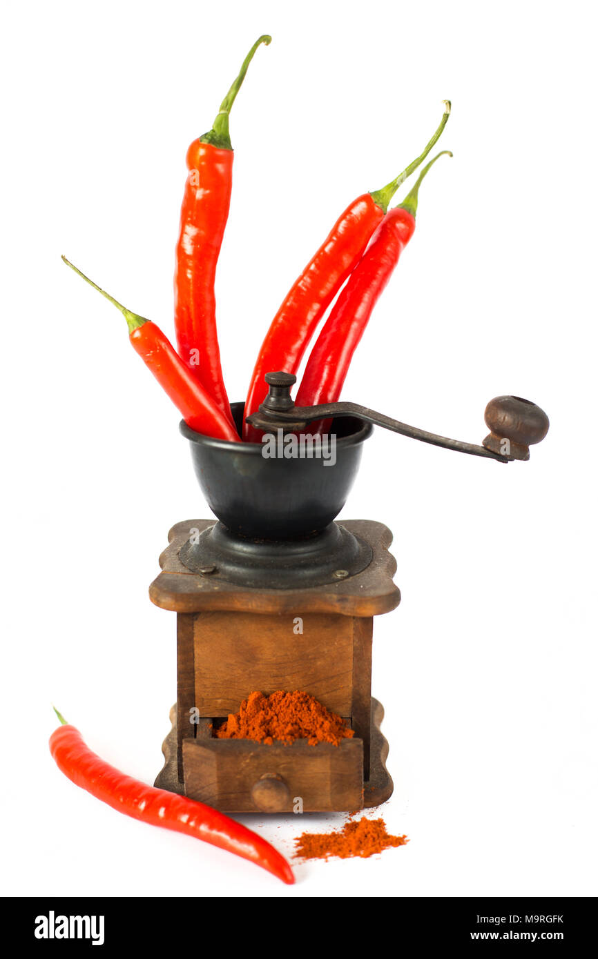 ground red pepper, grinder and paprikar on a white background Stock