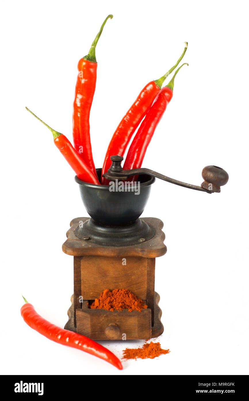 ground red pepper, grinder and paprikar on a white background Stock Photo -  Alamy