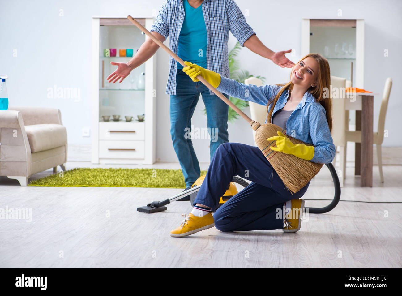 Woman cleaning home dancing vacuum hi-res stock photography and images ...