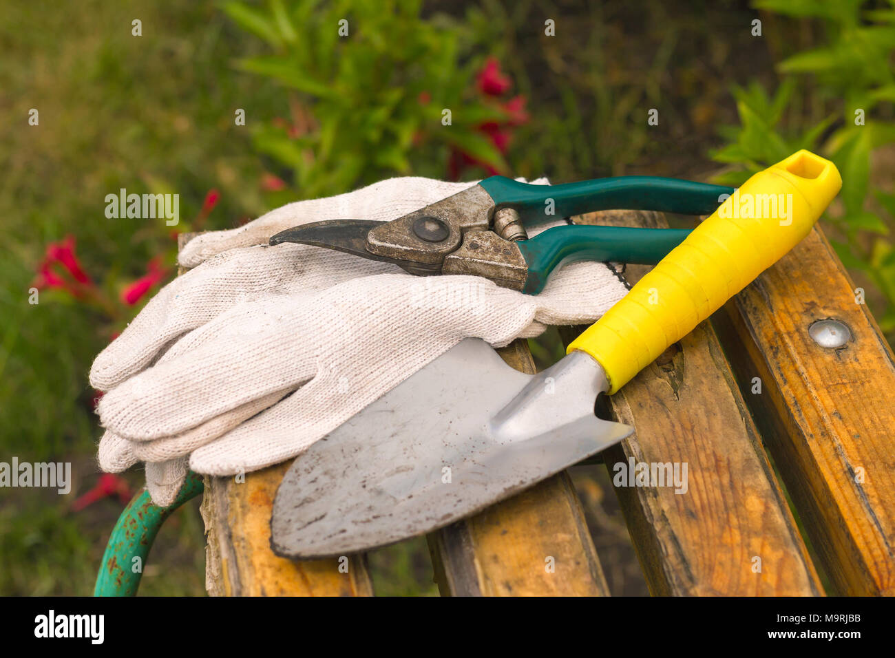 Worked Dirty Garden Tools Composition Laying On A Bench Stock