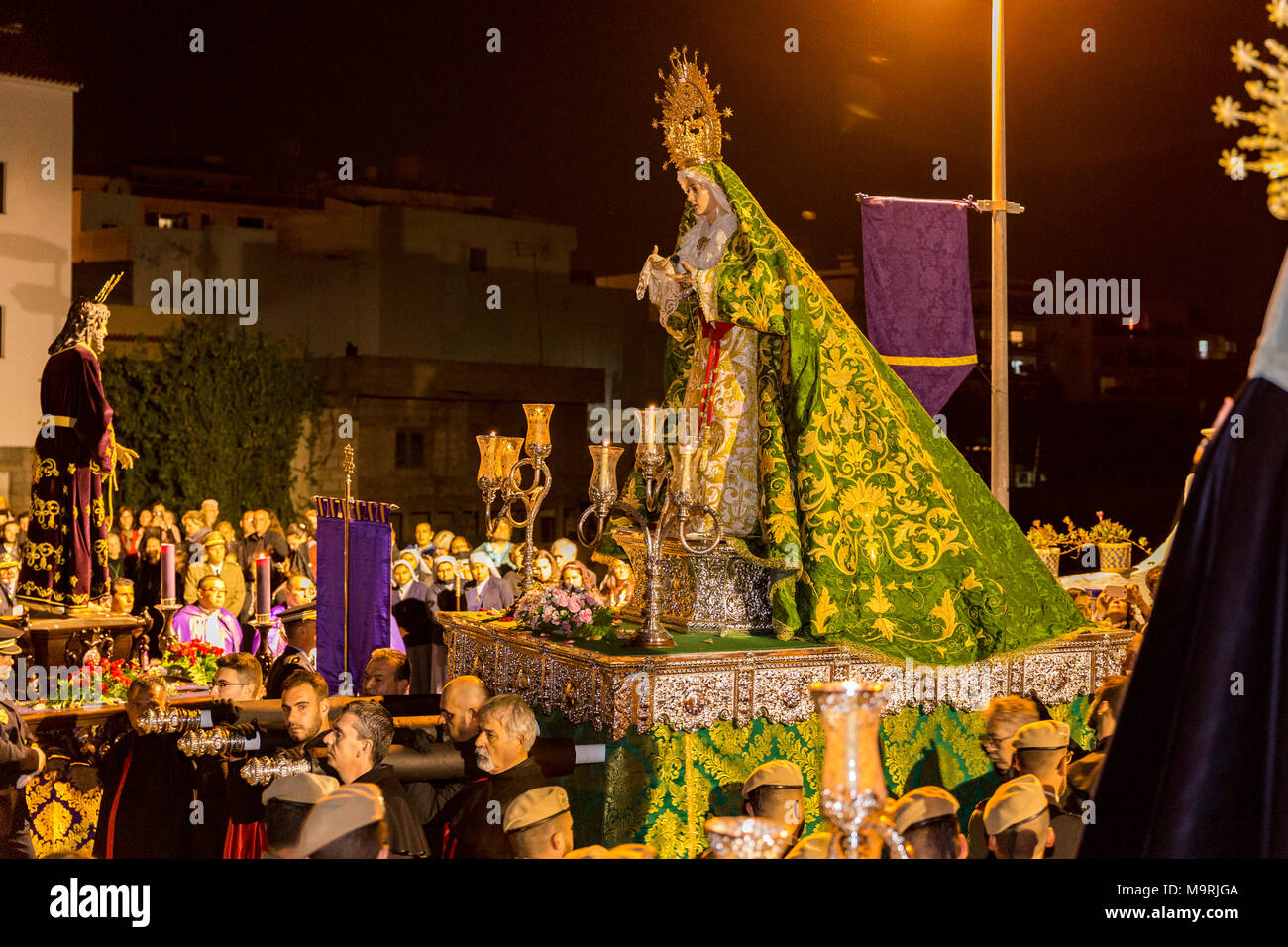 Catholic men carrying a lifesize statue of the Virgin Mary at a Holy