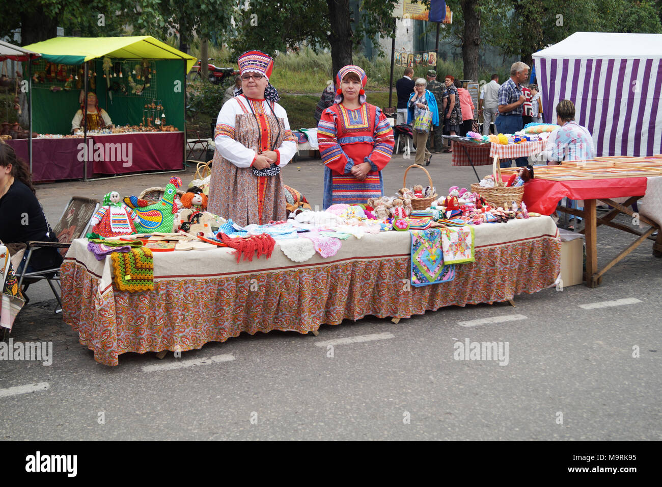 Mstyora,Russia-August 16,2014:Women(woman)s in national suit trade souvenir at day of the city Stock Photo