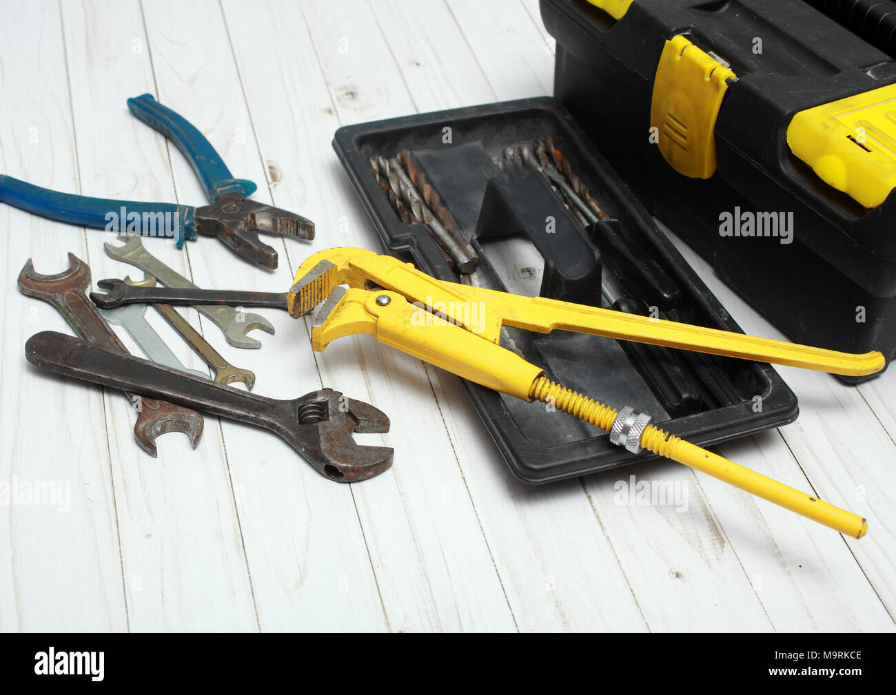 Tool box and different tools on a wooden table. Stock Photo