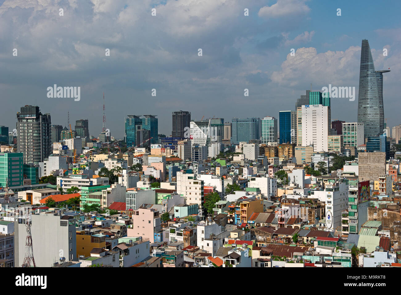 HO CHI MINH CITY, VIETNAM - APRIL 9, 2017: The sun sets over the Ho Chi Minh City skyline that mix the colonial and business district in Vietnam large Stock Photo