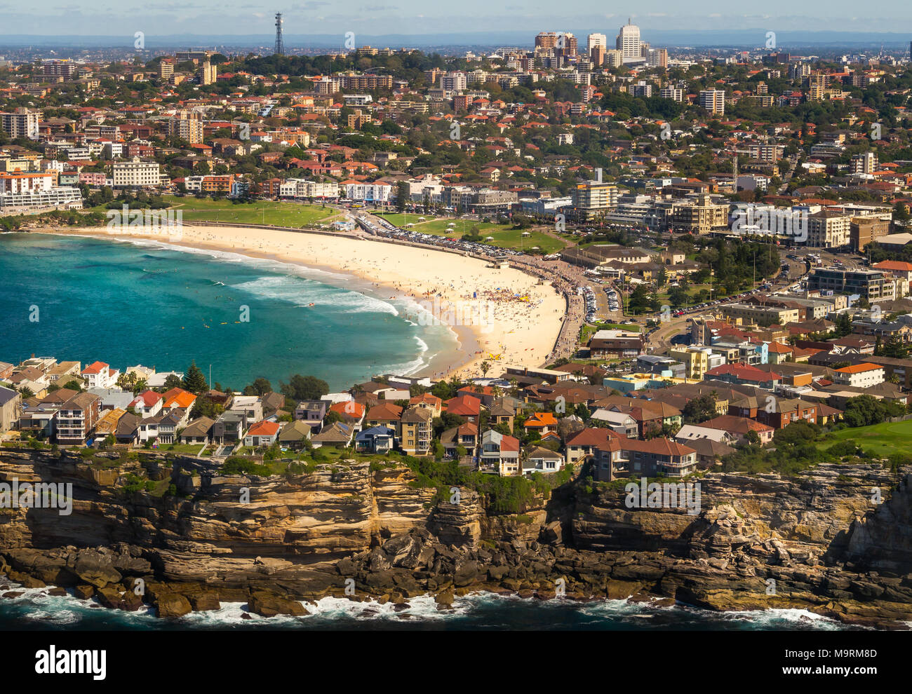 Aerial view from a small plane of Bondi beach, Sydney, Australia. A group of people can be seen gathered on the golden sand. Stock Photo