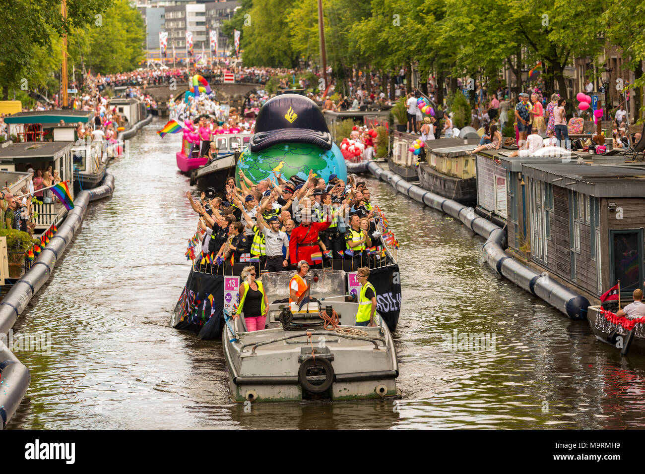 The police boat in the Prinsegracht during the Amsterdam CanalParade 2016 Stock Photo