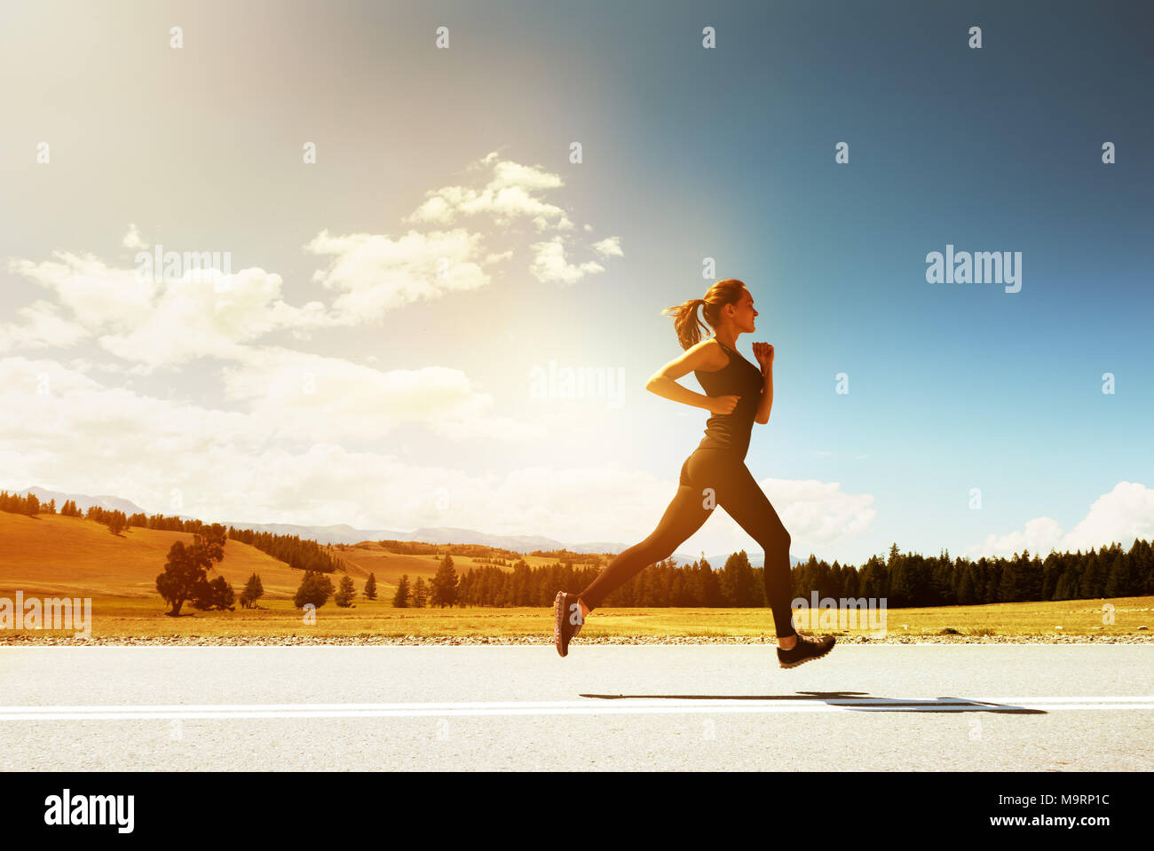 Slim girl run highway health nature outdoors Stock Photo