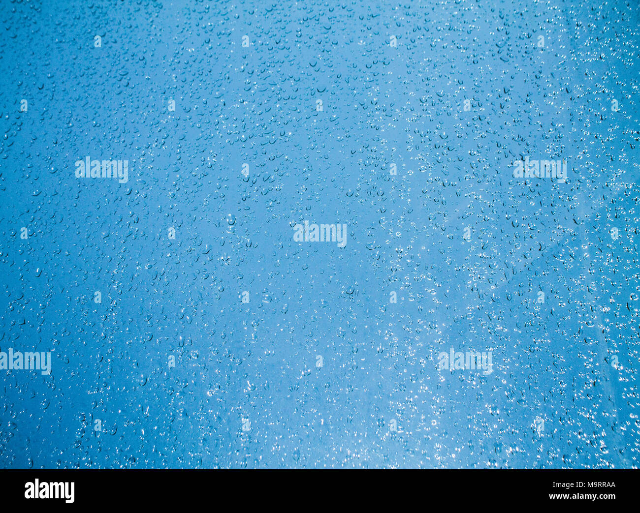 background water drops on blue glass Stock Photo - Alamy
