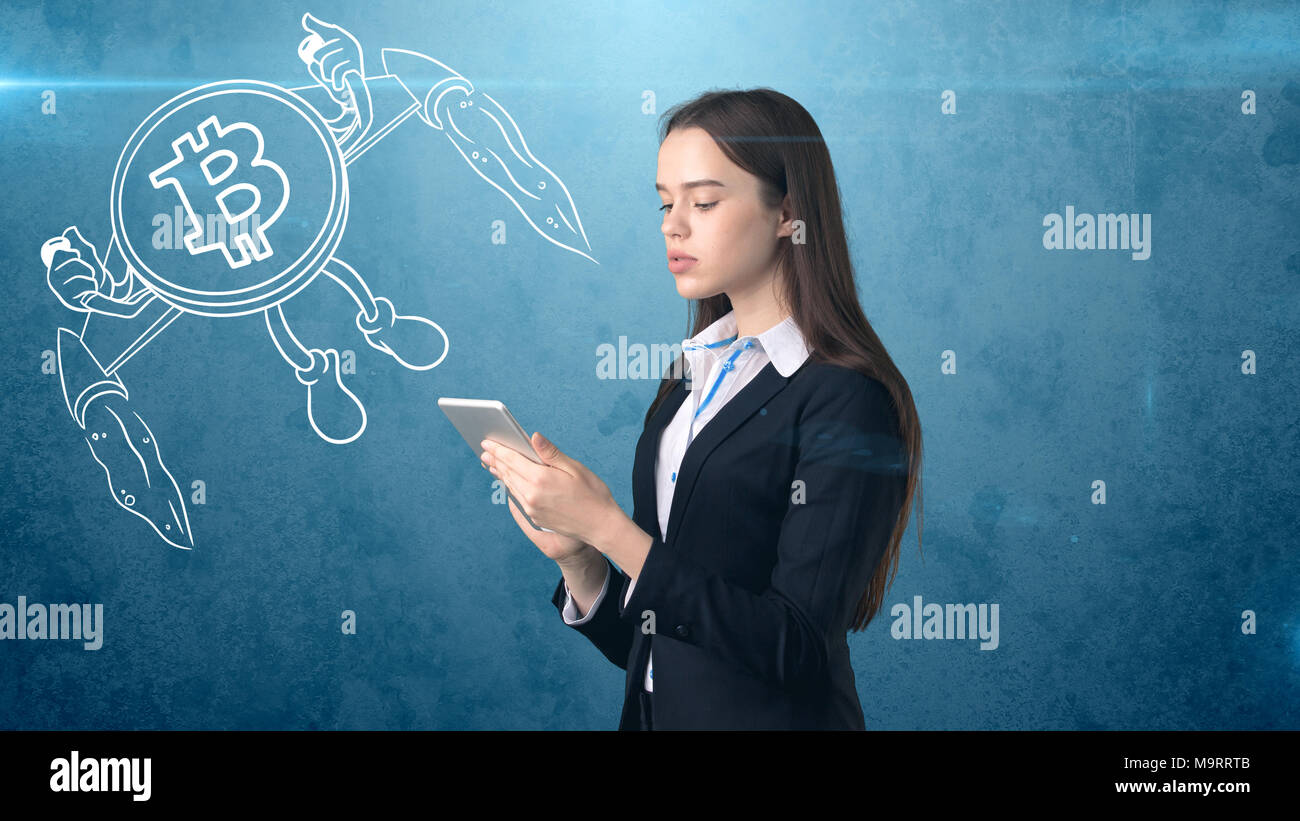 Beauty business woman standing near btc logo. Succesful Bitcoin investment.  Concept of virtual criptocurrency Stock Photo - Alamy