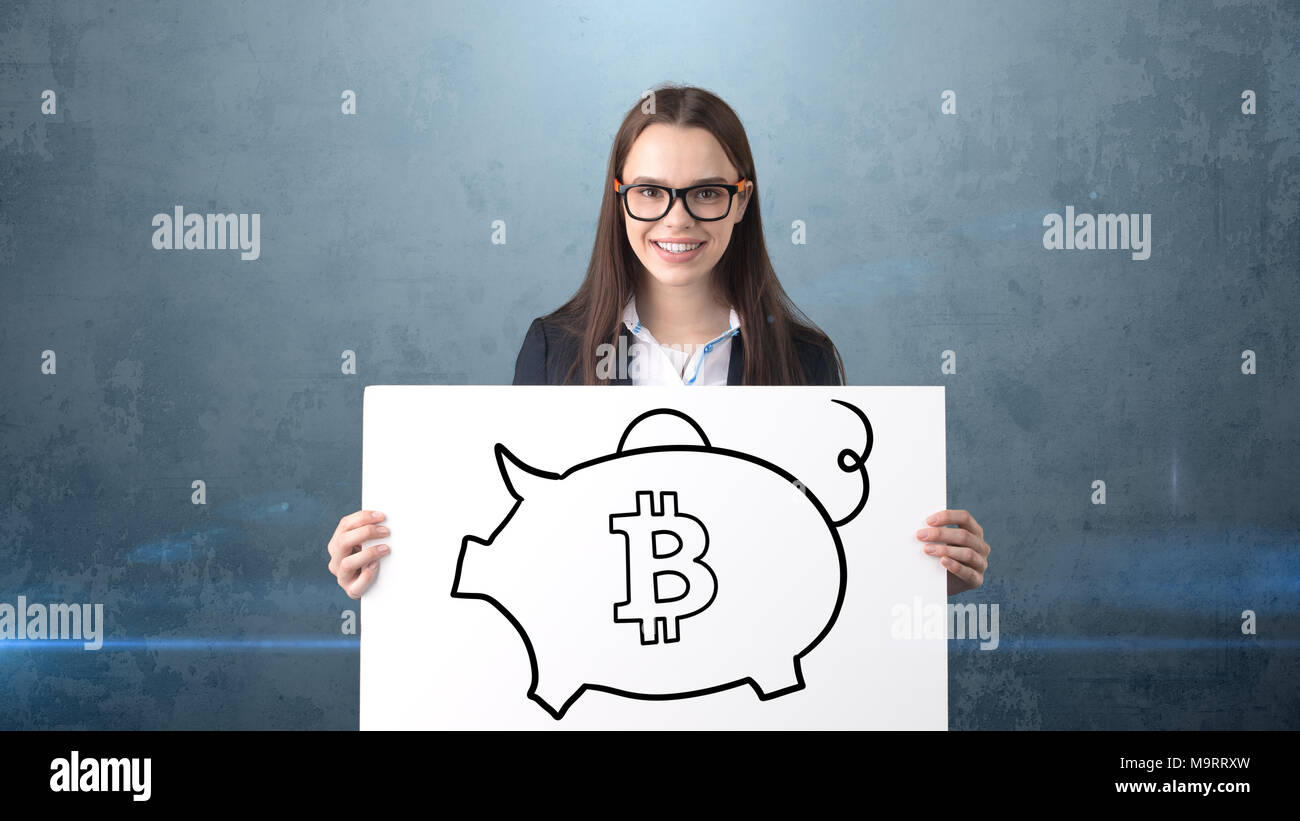 Beauty business woman standing near btc logo. Succesful Bitcoin investment.  Concept of virtual criptocurrency Stock Photo - Alamy