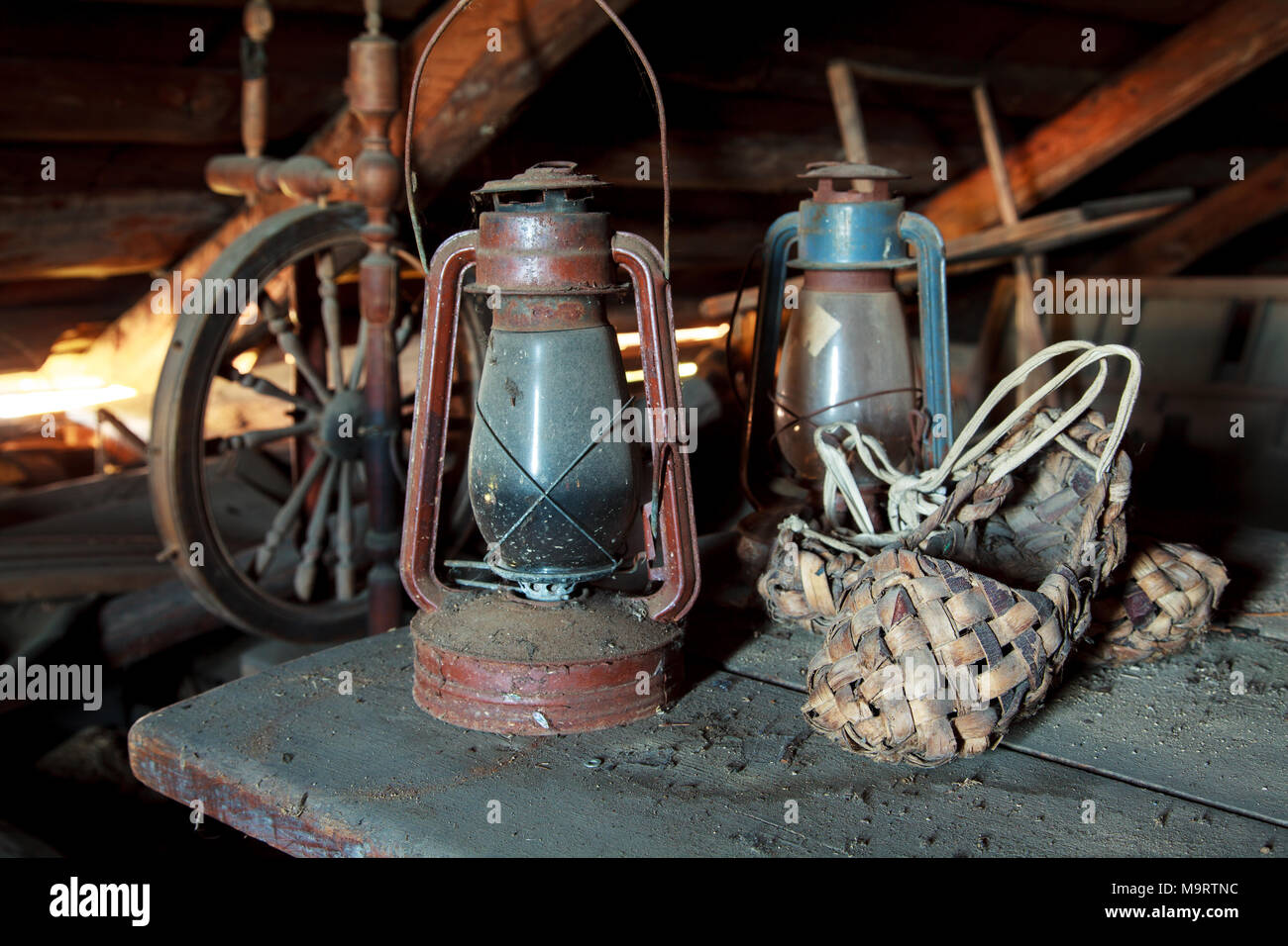 https://c8.alamy.com/comp/M9RTNC/russian-vintage-household-items-still-life-old-spinning-wheel-bast-shoes-and-a-kerosene-lamp-in-a-dusty-garret-in-the-country-house-selective-focu-M9RTNC.jpg