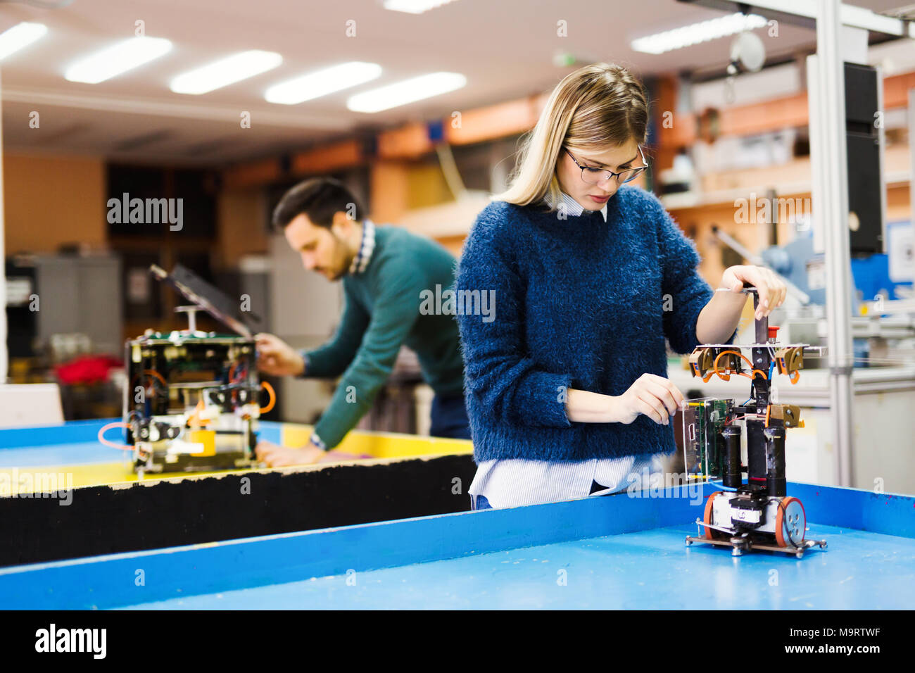 Young student of robotics working on project Stock Photo