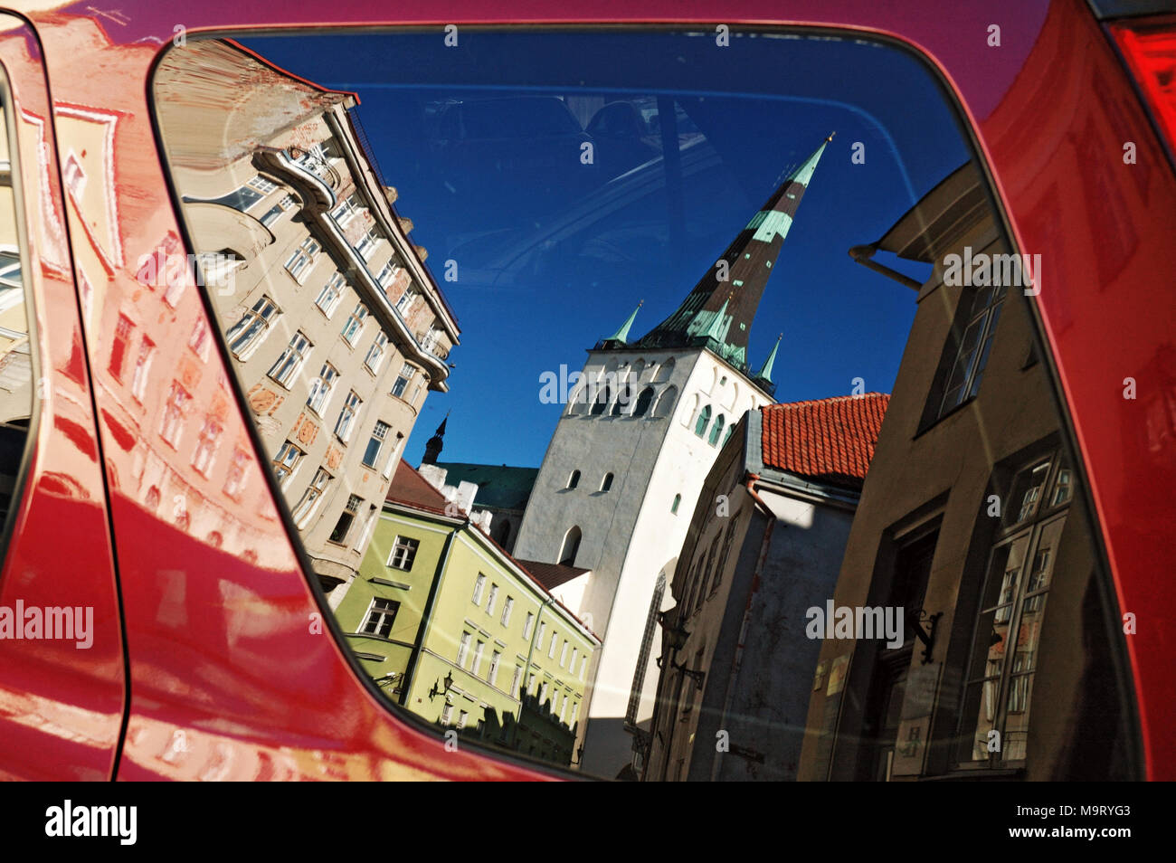 St. Olaf's Church reflected in a car window in Tallinn, Estonia Stock Photo