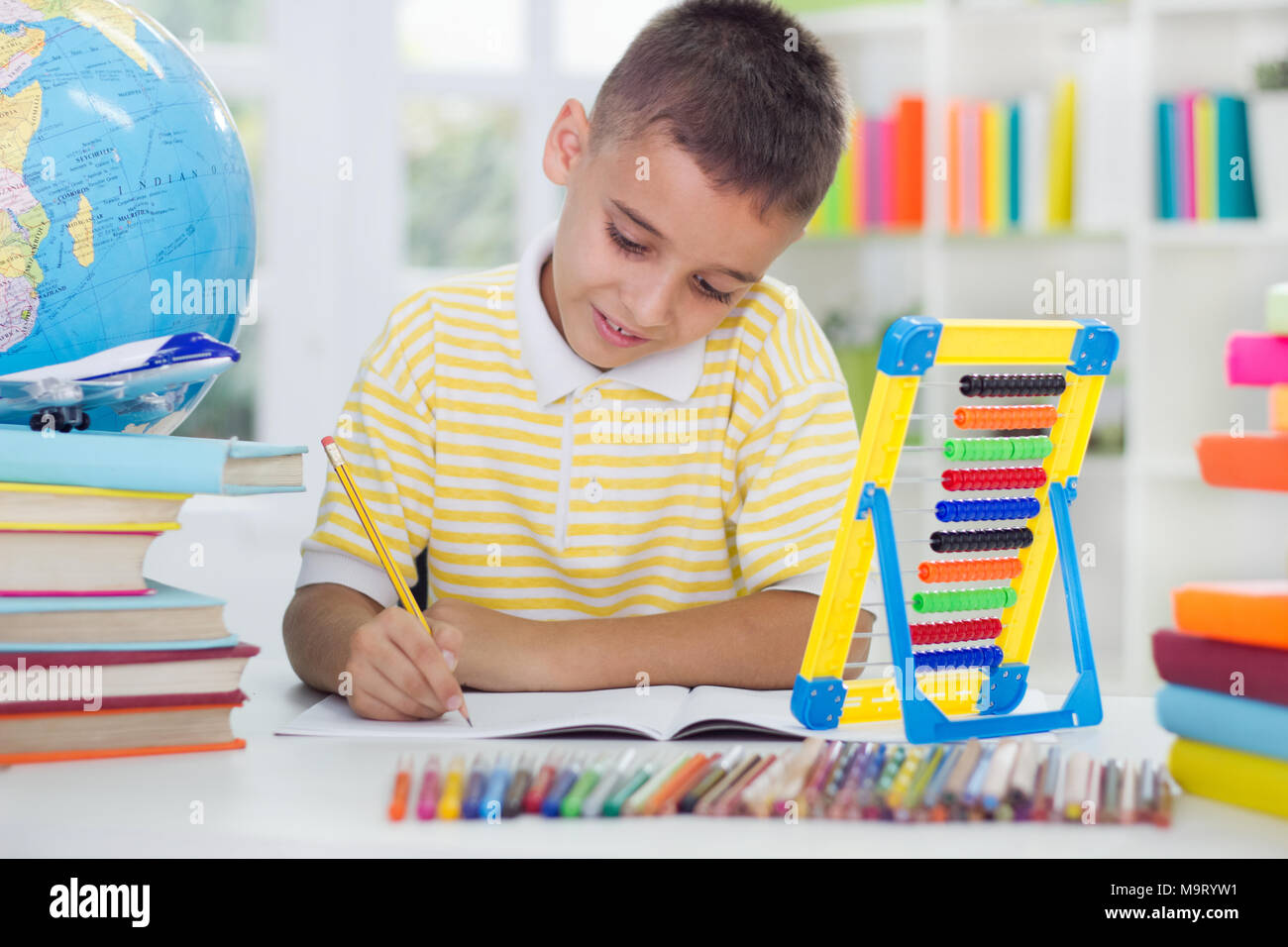 young boy learning at home Stock Photo