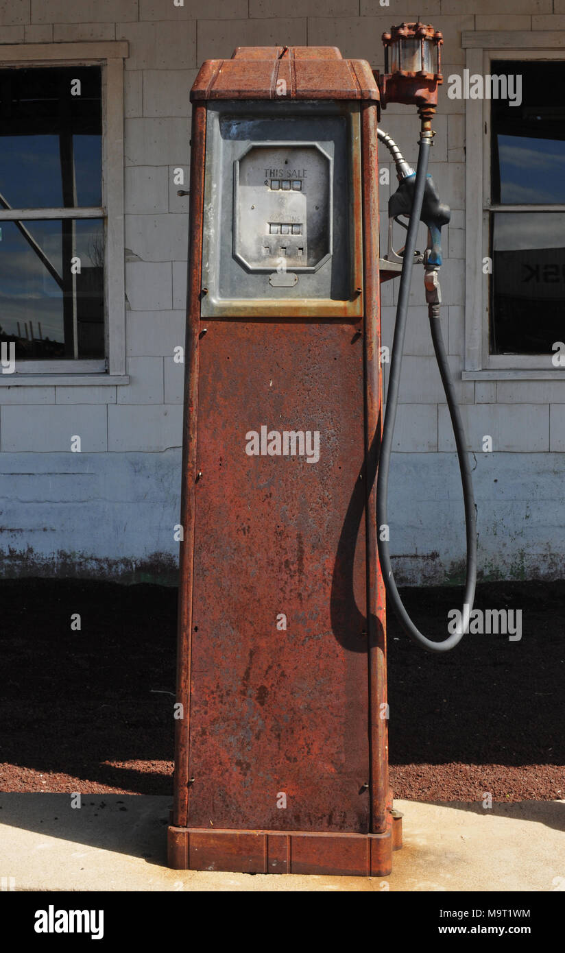 An old gas pump stands outside the Pine Breeze Inn in Bellemont, Arizona. The Route 66 business appeared in a scene in the 1969 film Easy Rider. Stock Photo