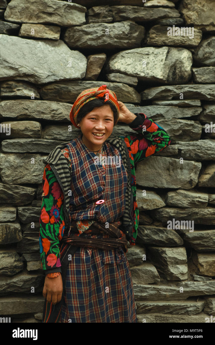 A native inhabitant young woman seen at her village. The Tamangs are a group of ethnic minority people mainly live in Nepal. Their population is estimated at around 1.5 million in 2016. Stock Photo