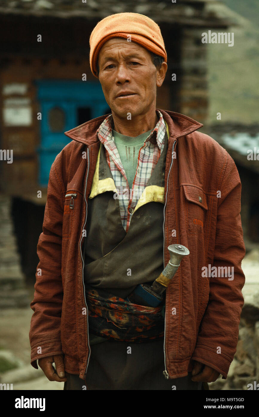 Local man with a traditional Kukri knife. The Tamangs are a group of ethnic minority people mainly live in Nepal. Their population is estimated at around 1.5 million in 2016. Stock Photo
