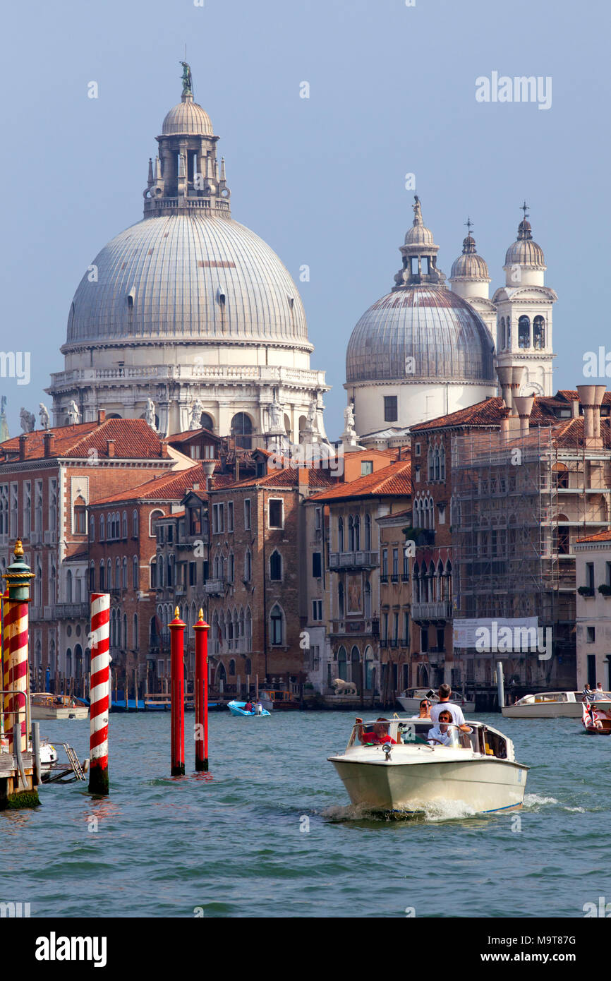 Basilica di Santa Maria della Salute / Santa Maria della Salute Church and water taxi boat, Venice, Veneto, Italy Stock Photo