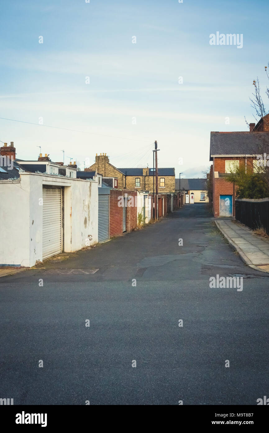 Back street and garages in a rundown northern UK town, Sunderland, Tyne and wear. Stock Photo