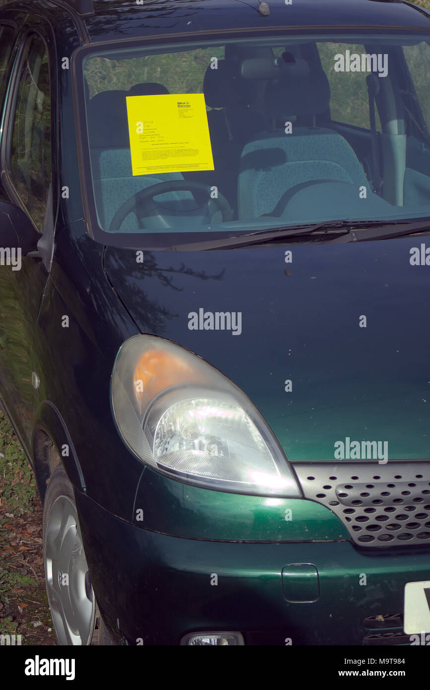 Notice on abandoned vehicle - Mid Devon District Council Stock Photo