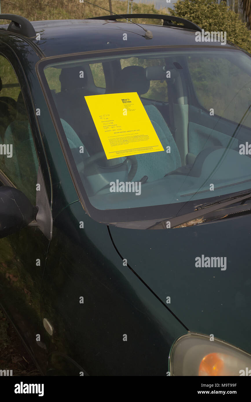 Notice on abandoned vehicle Mid Devon District Council Stock Photo