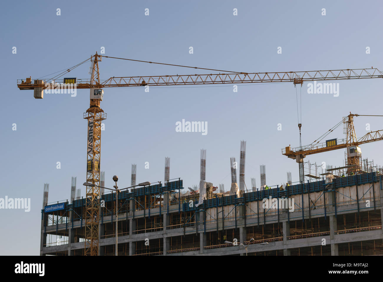Bucharest, Romania - January 25, 2018: Big yellow cranes construction building in Orhideea area of Bucharest. Stock Photo