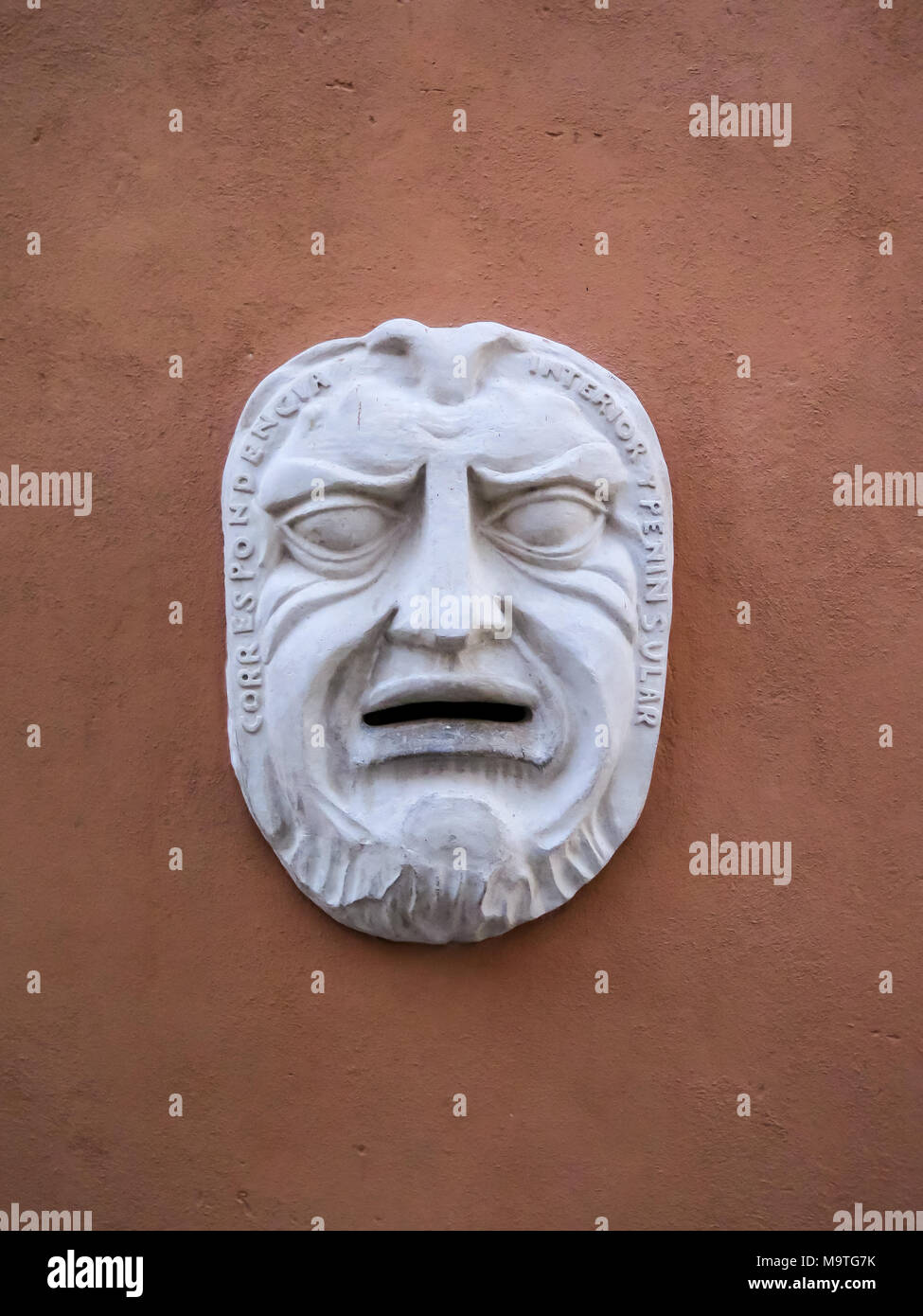 A plaster mask on the post office building in Havana Stock Photo