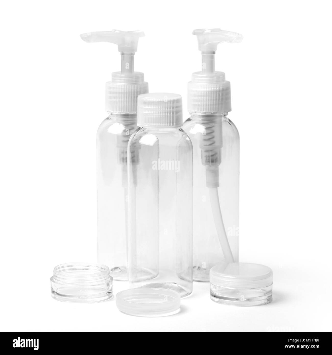 Several different empty colorless transparent plastic packaging for cosmetic products. Image with clipping path. Stock Photo