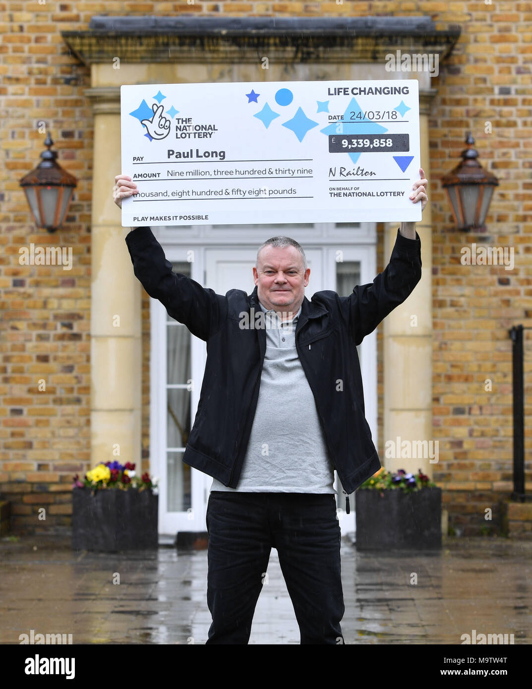 Father of three and life-long Leyton Orient fan from Wickford, Paul Long, celebrates after his Lucky Dip ticket matched all six numbers to scoop the £9,339,858 Lotto Jackpot on Saturday 24 March, at the Orsett Hall Hotel, in Orsett, Essex. Stock Photo
