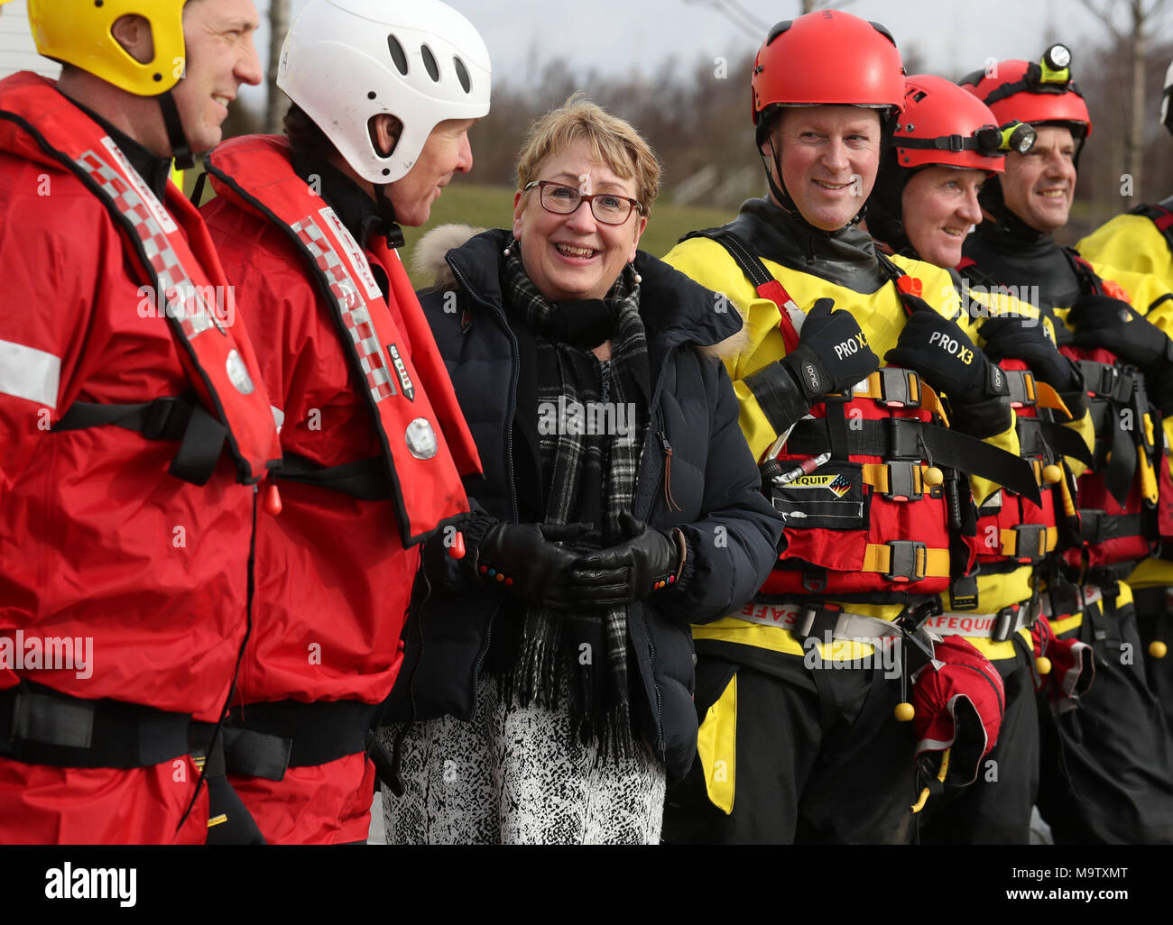 Community Safety Minister Annabelle Ewing chats with firemen from Falkirk and Bathgate fire stations after she was given a live water rescue demonstration at Falkirk's Helix Park, as she helps mark five years of the Scottish Fire and Rescue Service. Stock Photo