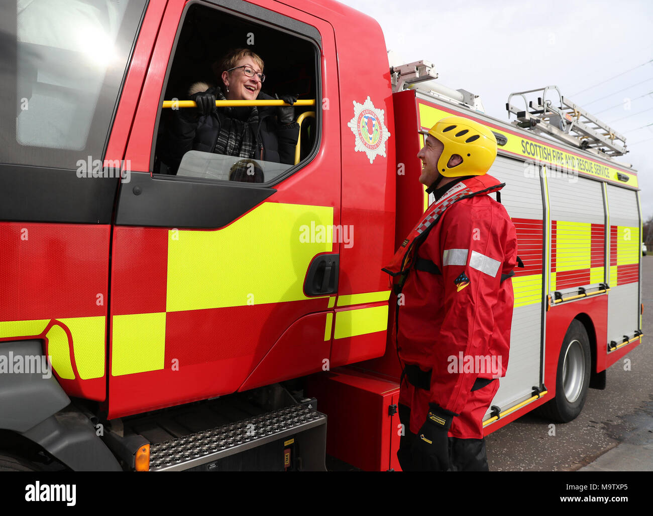 Community Safety Minister Annabelle Ewing chats with fireman Jamie Scott from Falkirk fire station after she was given a live water rescue demonstration at Falkirk's Helix Park, as she helps mark five years of the Scottish Fire and Rescue Service. Stock Photo