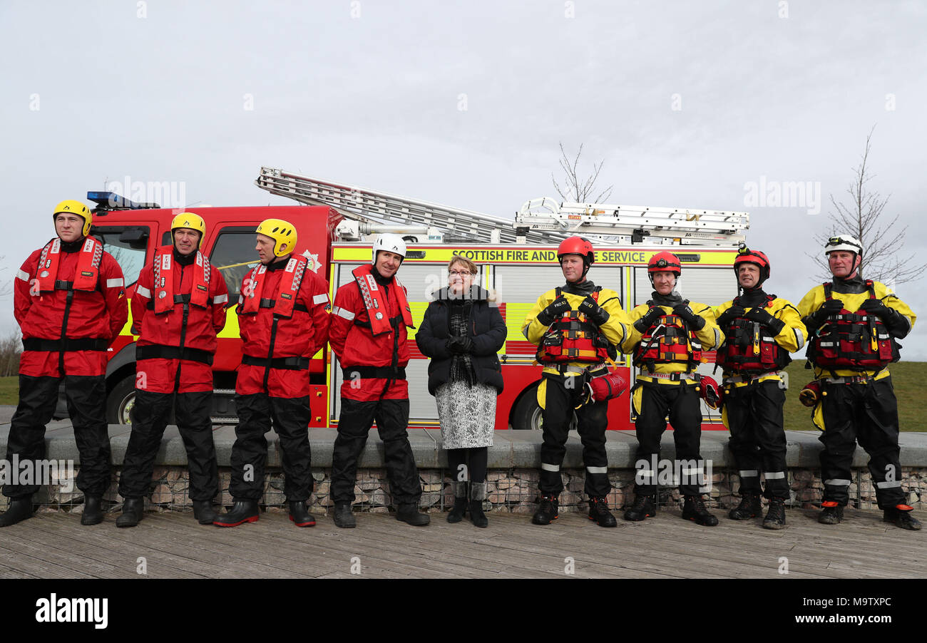 Community Safety Minister Annabelle Ewing chats with firemen from Falkirk and Bathgate stations after she was given a live water rescue demonstration at Falkirk's Helix Park, as she helps mark five years of the Scottish Fire and Rescue Service. Stock Photo