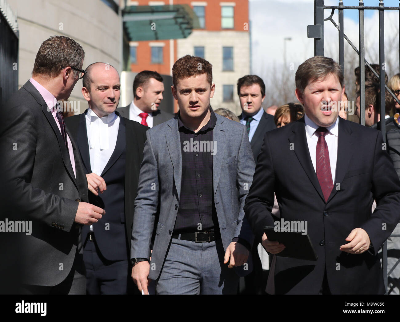 Ireland and Ulster rugby player Paddy Jackson (centre) leaving Belfast Crown Court where he has been found not guilty of raping a woman at a property in south Belfast in June 2016. Stock Photo